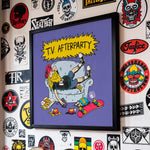 Cargar imagen en el visor de la galería, a framed poster with a cartoon illustration of a person lying on a couch with a skateboard and various objects around them, such as a pizza and a beer bottle.
