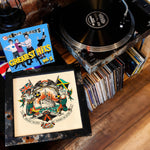 Lade das Bild in den Galerie-Viewer, a collection of music-related items, including a turntable, a framed artwork, and a stack of CDs.
