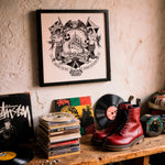 Load image into Gallery viewer, a collection of music-related items, including a framed artwork, a stack of CDs, a record album, and a pair of red boots, all displayed on a wooden surface.
