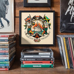 Lade das Bild in den Galerie-Viewer, a framed artwork with a colorful design, surrounded by a stack of CDs and DVDs on a wooden shelf.
