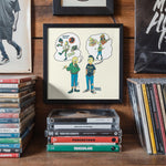 Lade das Bild in den Galerie-Viewer, a framed cartoon illustration of two people with thought bubbles, surrounded by a collection of CDs and DVDs on a shelf.
