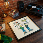 Lade das Bild in den Galerie-Viewer, a framed cartoon drawing of two people, one with a thought bubble containing a CD and another with a thought bubble containing a CD. The drawing is placed on a wooden surface, surrounded by various objects such as a record player, a lamp, and a stack of CDs.
