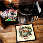 Lade das Bild in den Galerie-Viewer, a collection of vinyl records and a framed poster on a wooden floor, creating a nostalgic and artistic atmosphere.
